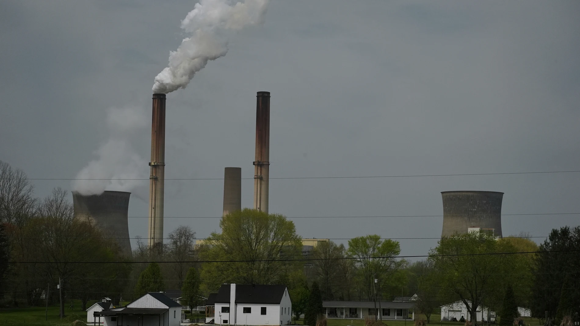 FILE - A home sits near the Gen. James Gavin Power Plant, a coal-fired power plant, April 14, 2025, in Point Pleasant, W.Va. (AP Photo/Joshua A. Bickel, File)