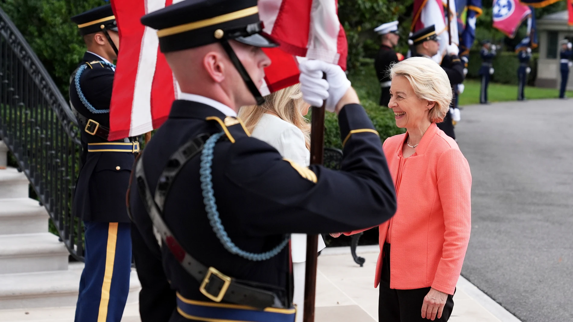 Monica Crowley, White House chief of protocol, obstructed center, greets European Commission President Ursula von der Leyen, right, upon arriving to meet with President Donald Trump and Ukraine's President Volodymyr Zelenskyy, Monday, Aug. 18, 2025, at the South Portico of the White House in Washington. (AP Photo/Jacquelyn Martin)