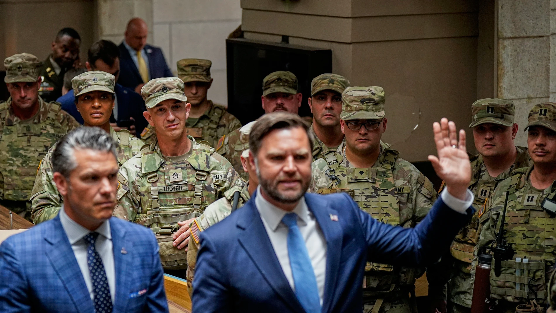 Vice President JD Vance and Defense Secretary Pete Hegseth meet with members of the National Guard at Union Station in Washington, Wednesday, Aug. 20, 2025. (Alexander Drago/Pool via AP)