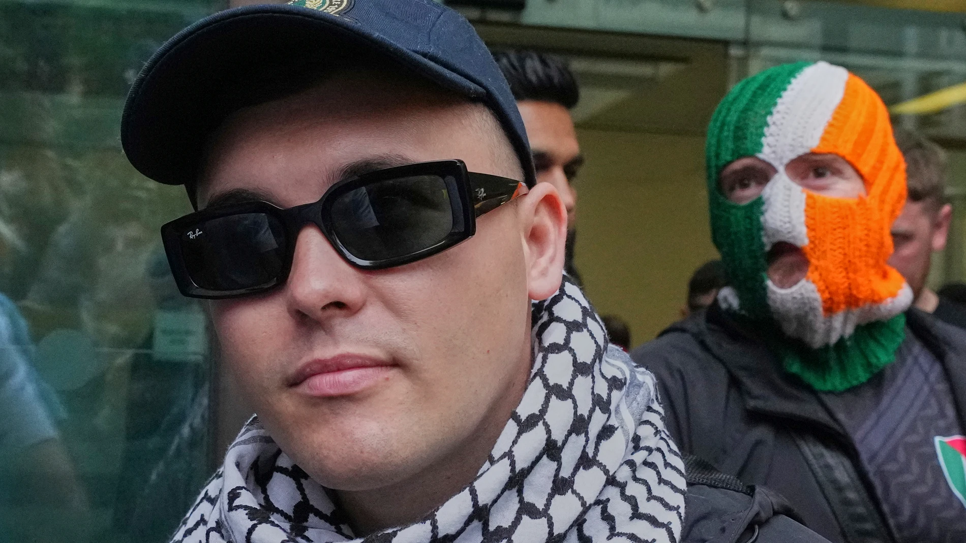 Liam Óg Ó hAnnaidh, aka Mo Chara, a member of the Irish language band Kneecap, departs Westminster Magistrates Court London, Wednesday, Aug. 20, 2025, where he is charged with a terrorism offence relating to displaying a flag in support of Hezbollah during a performance with the band in November 2024. (AP Photo/Frank Augstein)