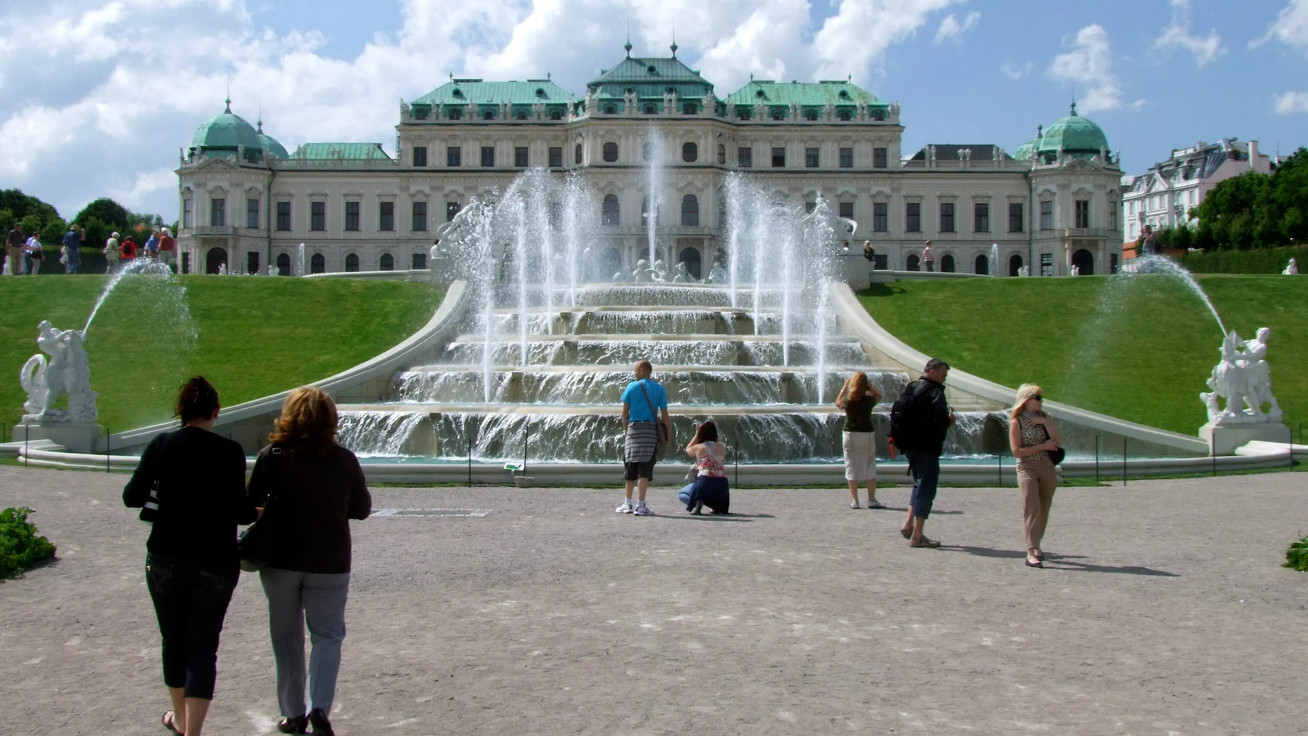 FILE - Tourists enjoy the sunny weather in front of Vienna's Belvedere Palace Austria, on Thursday, June 24, 2010. (AP Photo/Hans Punz, File)