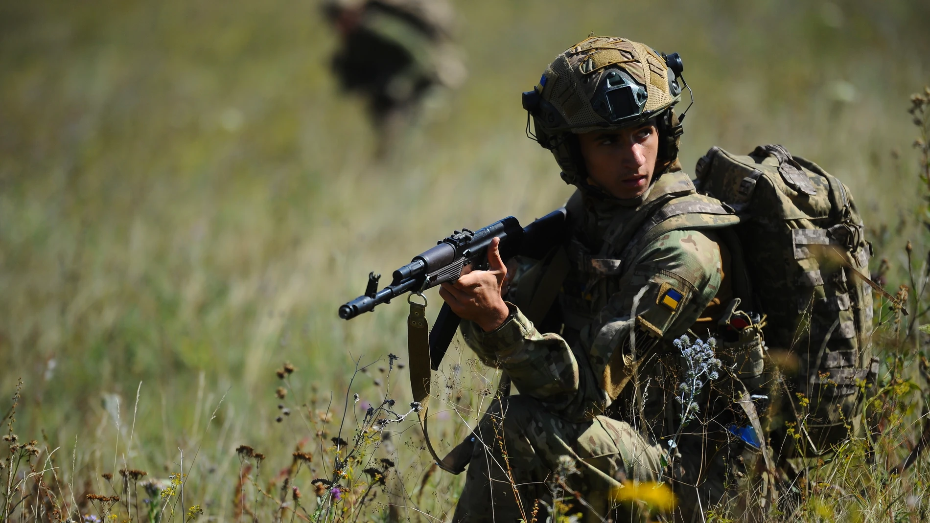In this photo, taken on Tuesday, Aug. 19, 2025 and provided by Ukraine's 127th Separate Brigade of the Territorial Defence press service, soldiers aged 18 to 24 practice military skills on a training ground near Kharkiv, Ukraine. (Anatolii Lysianskyi/Ukraine's 127th Separate Brigade via AP)