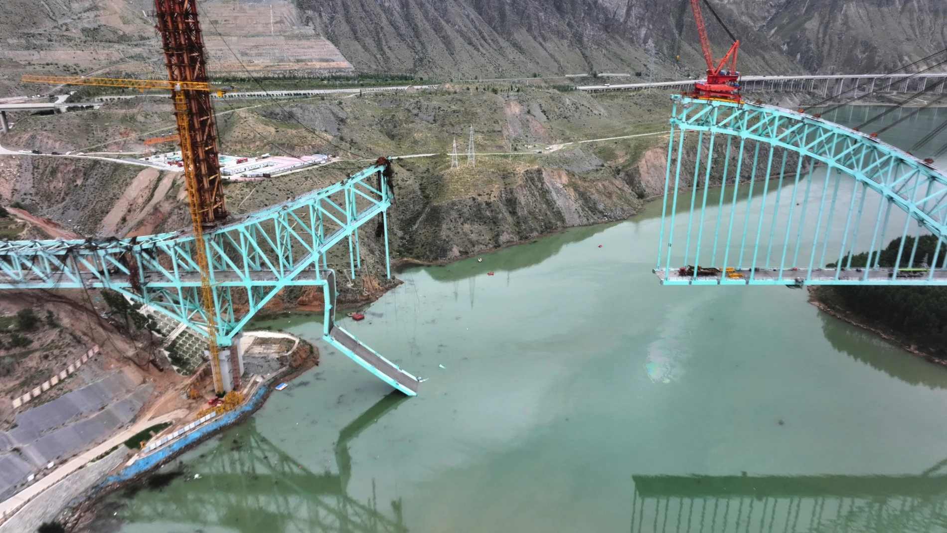 This aerial photo released by Xinhua News Agency shows the site of an under construction bridge that collapsed on the Qinghai section of the Sichuan-Qinghai Railway causing multiple dead and missing, in northwest China's Qinghai Province on Friday, Aug. 22, 2025. (Li Zhanyi/Xinhua via AP)