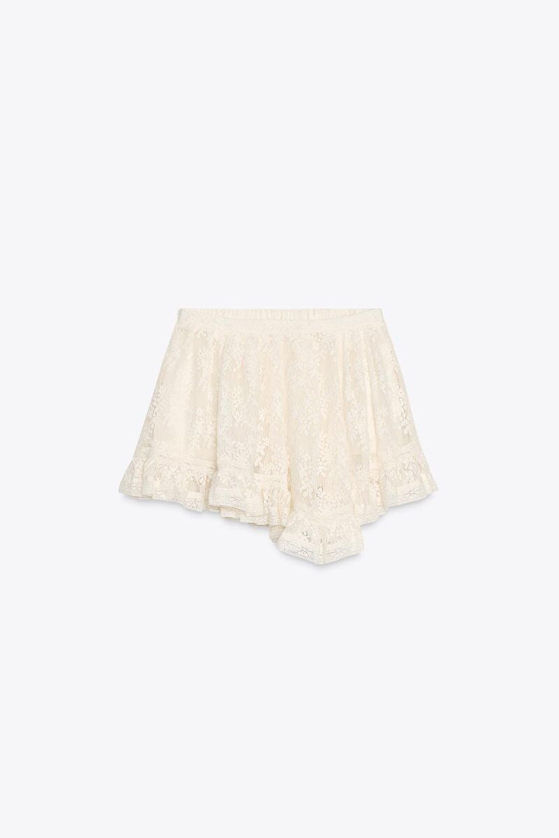 Falda mini encaje volantes.