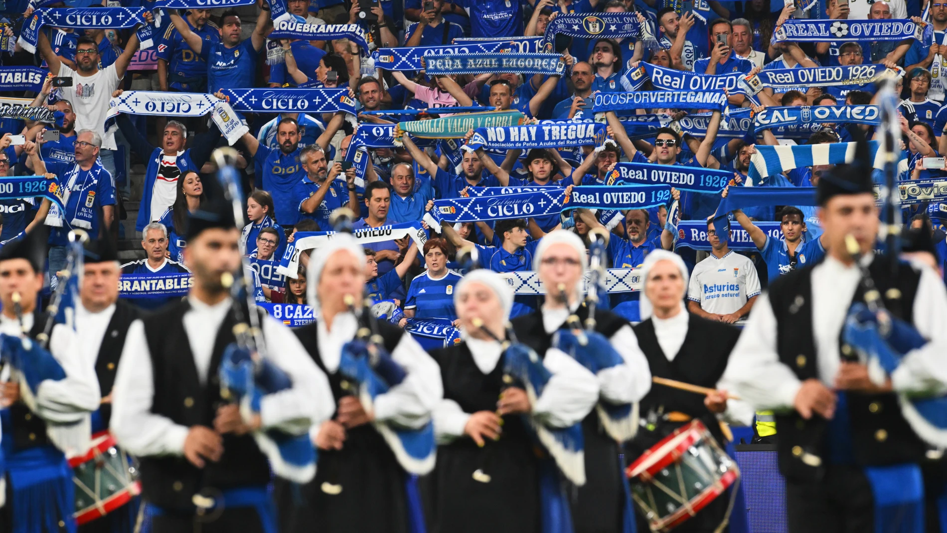 Fans of Oviedo hold up their scarfs prior to a Spanish La Liga soccer match between Real Oviedo and Real Madrid at Carlos Tartiere stadium in Oviedo, Spain, Sunday, Aug. 24, 2025. (AP Photo/Miguel Oses)