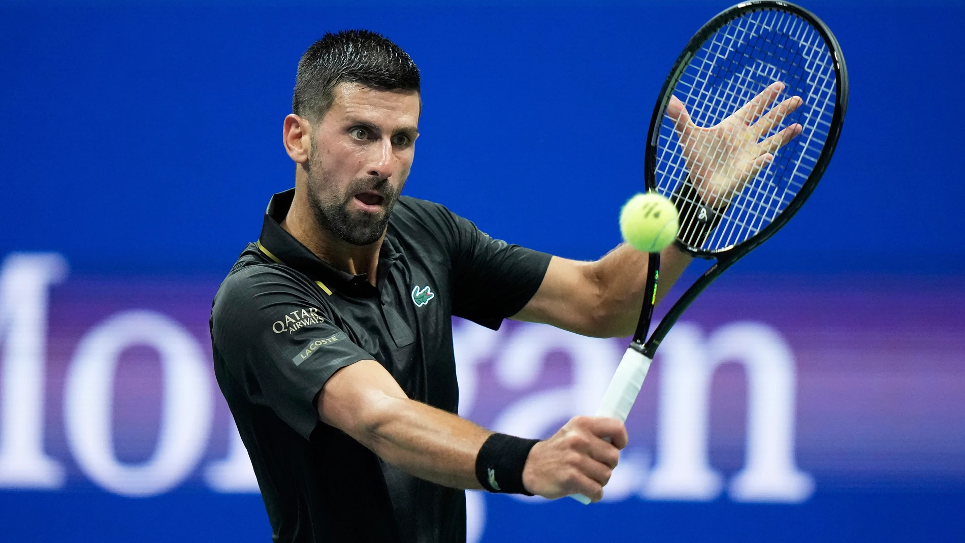 Novak Djokovic, of Serbia, returns a shot to Learner Tien, of the United States, during the first-round of the U.S. Open tennis championships, Sunday, Aug. 24, 2025, in New York. (AP Photo/Frank Franklin II)