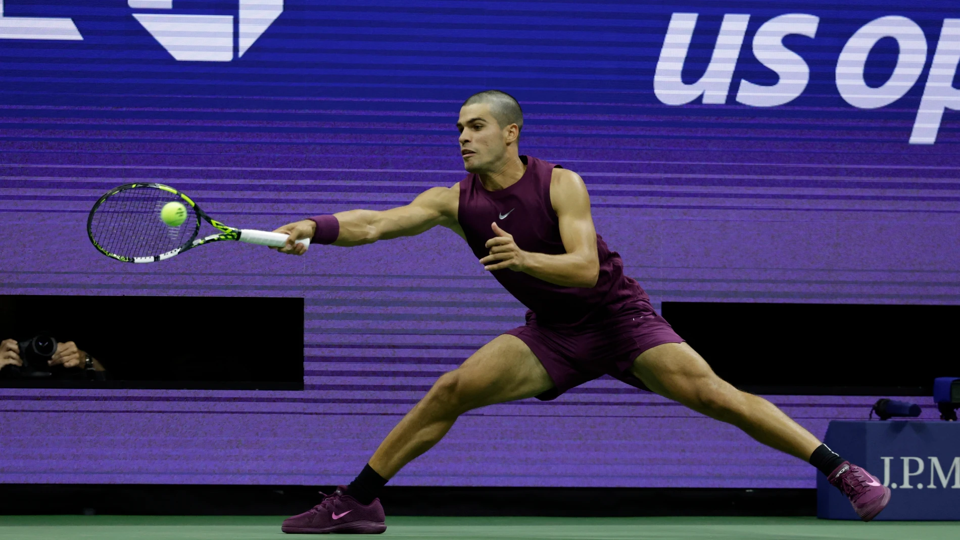 Carlos Alcaraz, of Spain, returns a shot to Reilly Opelka, of the United States, during the first round of the U.S. Open tennis championships, Monday, Aug. 25, 2025, in New York. (AP Photo/Adam Hunger)